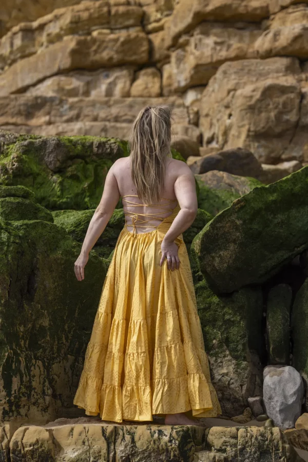 The backside of the Sunshine PhoeniX Dress Yellow/gold